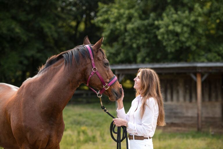 get a loan for a horse farm - Denise with a horse